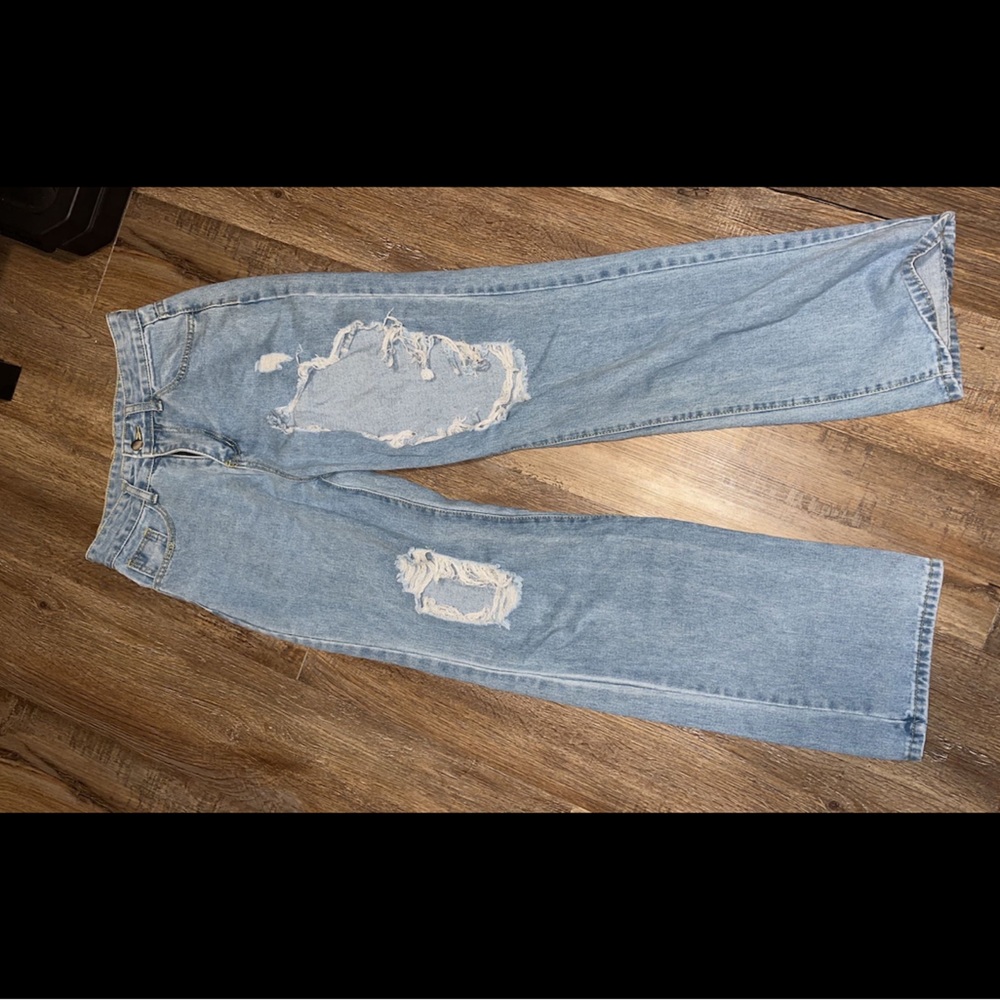 These are blue jeans with a some holes in them. They are size medium.
